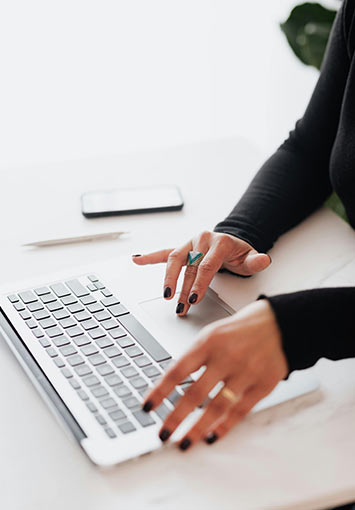 Woman using a computer in an office setting