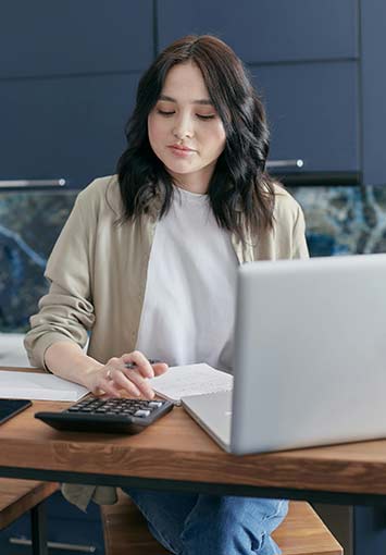 Worker working with invoice scanning and a computer