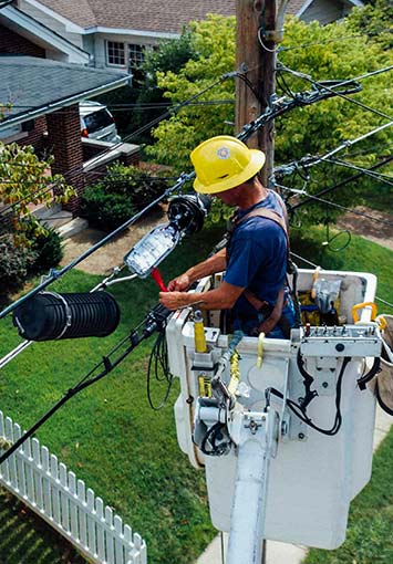 Utility company employee working on powerlines