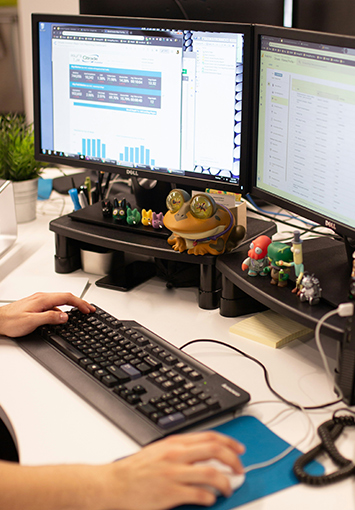 Office worker using digital files on a computer